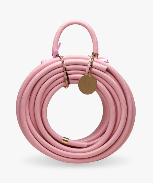 Rusty rose colored pink garden hose